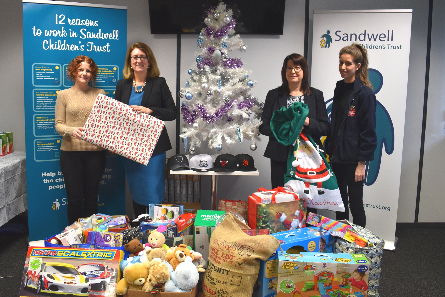 Lucy Hindle and Georgia Heath from Wiggles and Giggles with Jacqui Smith, Chair of Sandwell Children's Trust, Frances Craven, Chief Executive